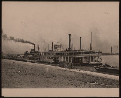 Horizontal, black and white photograph of the steamboat C.R. Suter. Another steamboat is parked behind it and crates are piled on the shore by William G. Swekosky